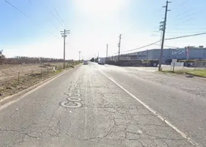 [10-04-2024] Stanislaus County, CA – Ambulance Responds To Scene After Crash Involving Big Rig on Codoni Avenue in Modesto